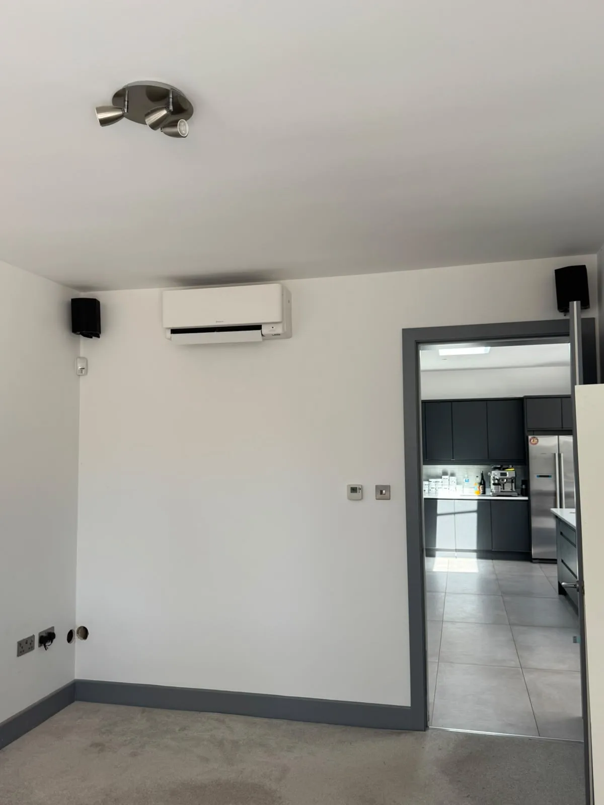 Daikin wall-mounted air conditioning unit installed in a living room